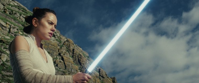 Star Wars: The Last Jedi — Rey holding Luke's lightsaber
